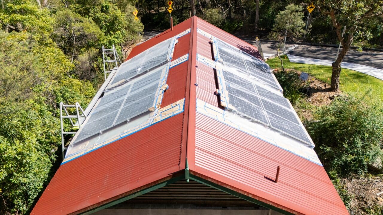 A red-roofed building, expertly restored by Roof Restorations at Blue Mountains Painting