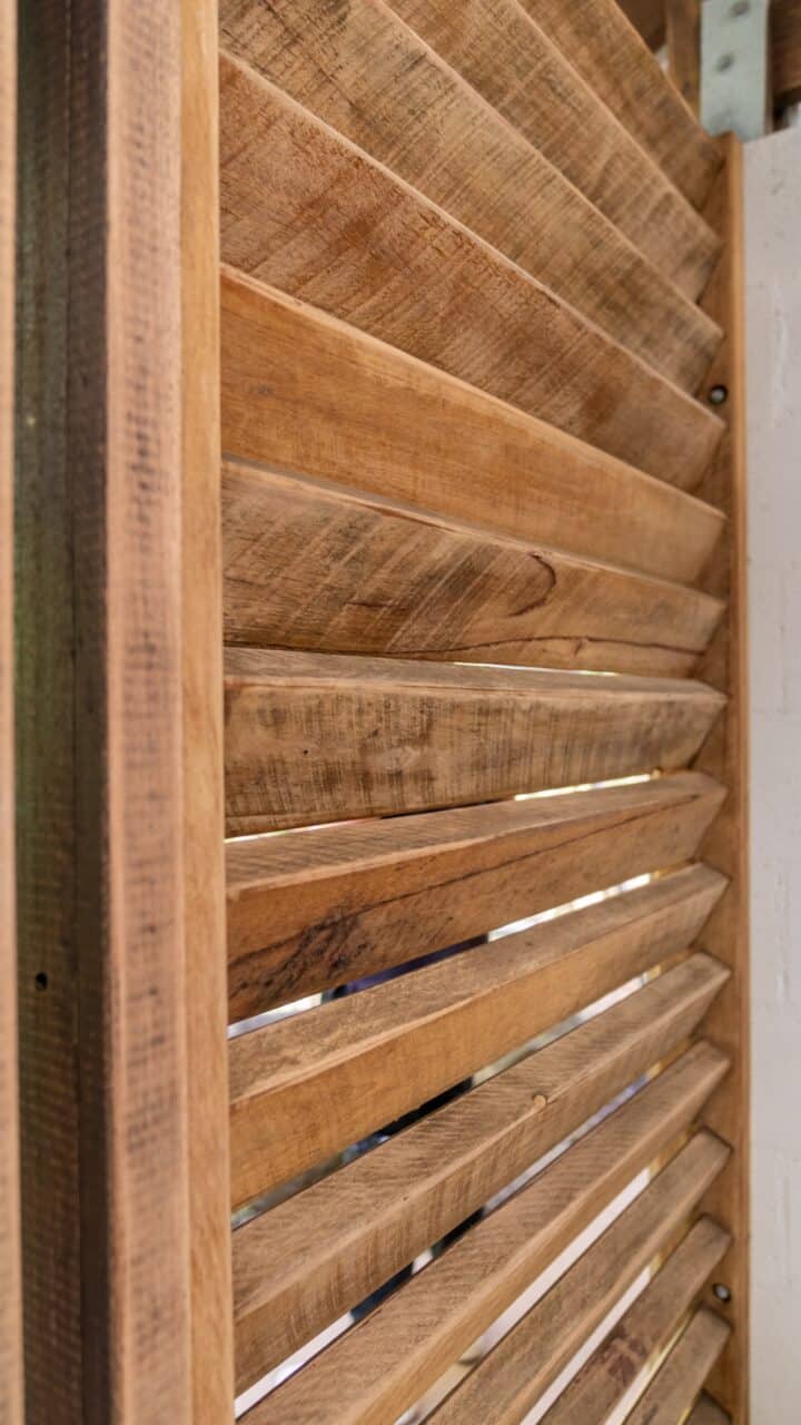 Close-up of an angled wooden slat wall or partition