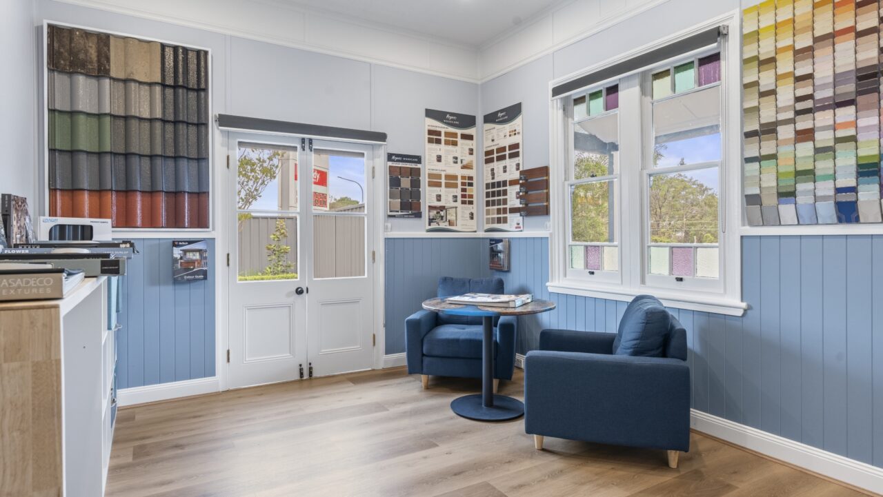 Vibrant room in bullaburra house with colorful paint swatches on the walls.