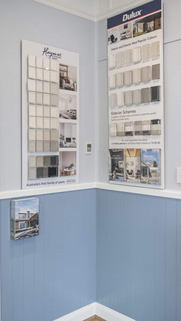 A brochure holder lies surrounded by an elegant display of paint color samples.
