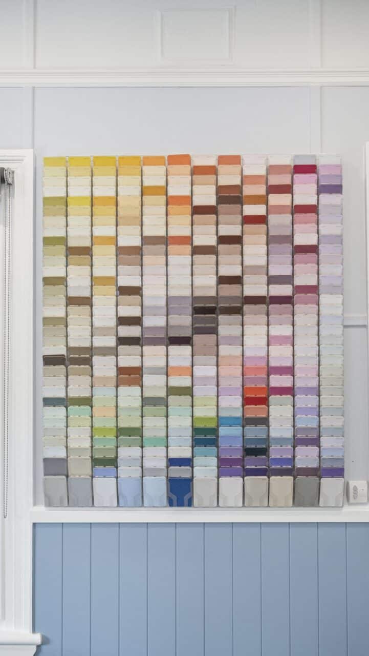 Vibrant grid of colorful paint swatches adorns the wall at bullaburra house.