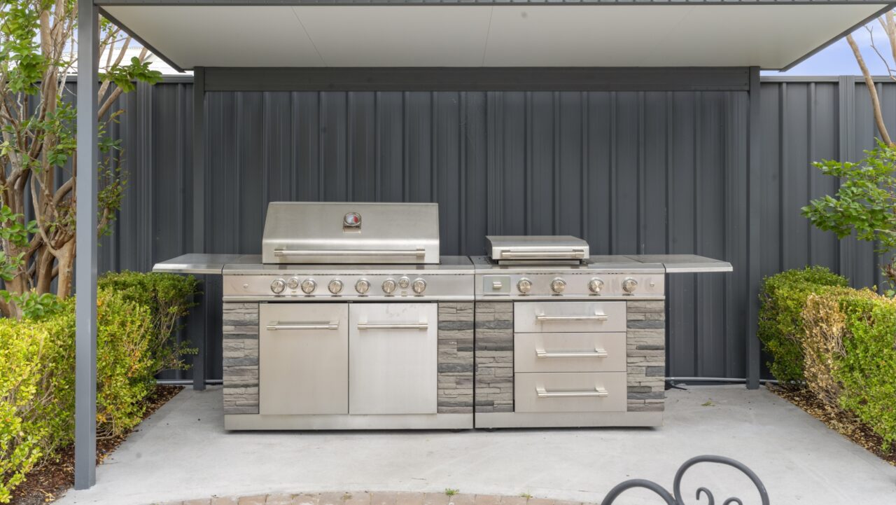bullaburra house featuring an outdoor stainless-steel grill with side burners and storage