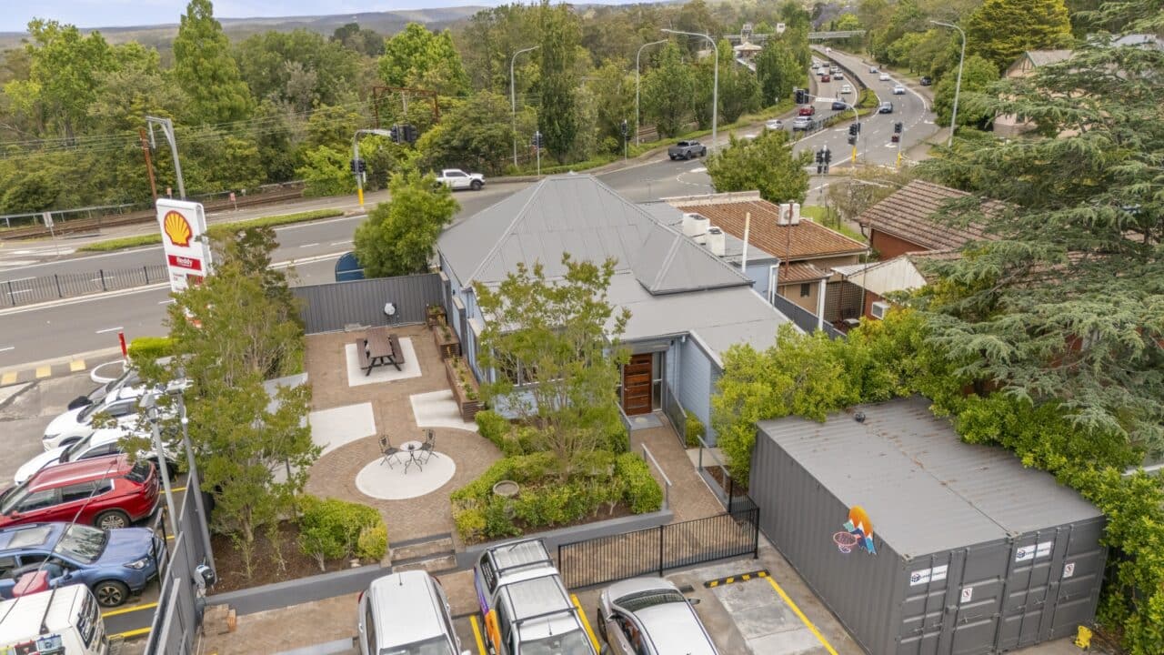Aerial view of bullaburra house and a small building with a lush garden area.