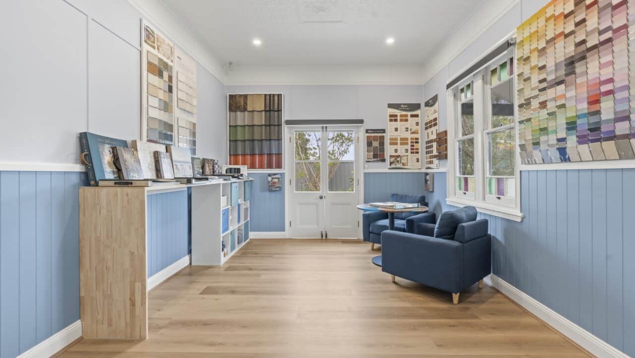 Bullaburra house featuring a room with light blue walls and wooden floor.